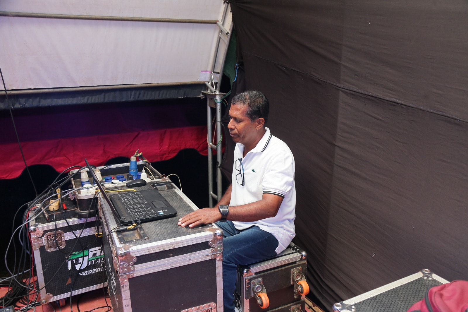 Professional stage lighting setup at a live event by Clarance Tissera